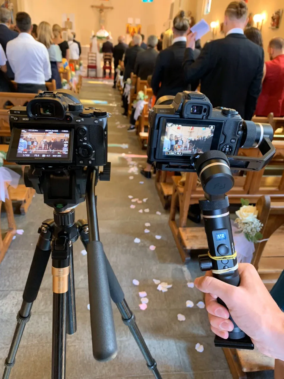 Cameras on a gimbal and tripod during a ceremony in a church