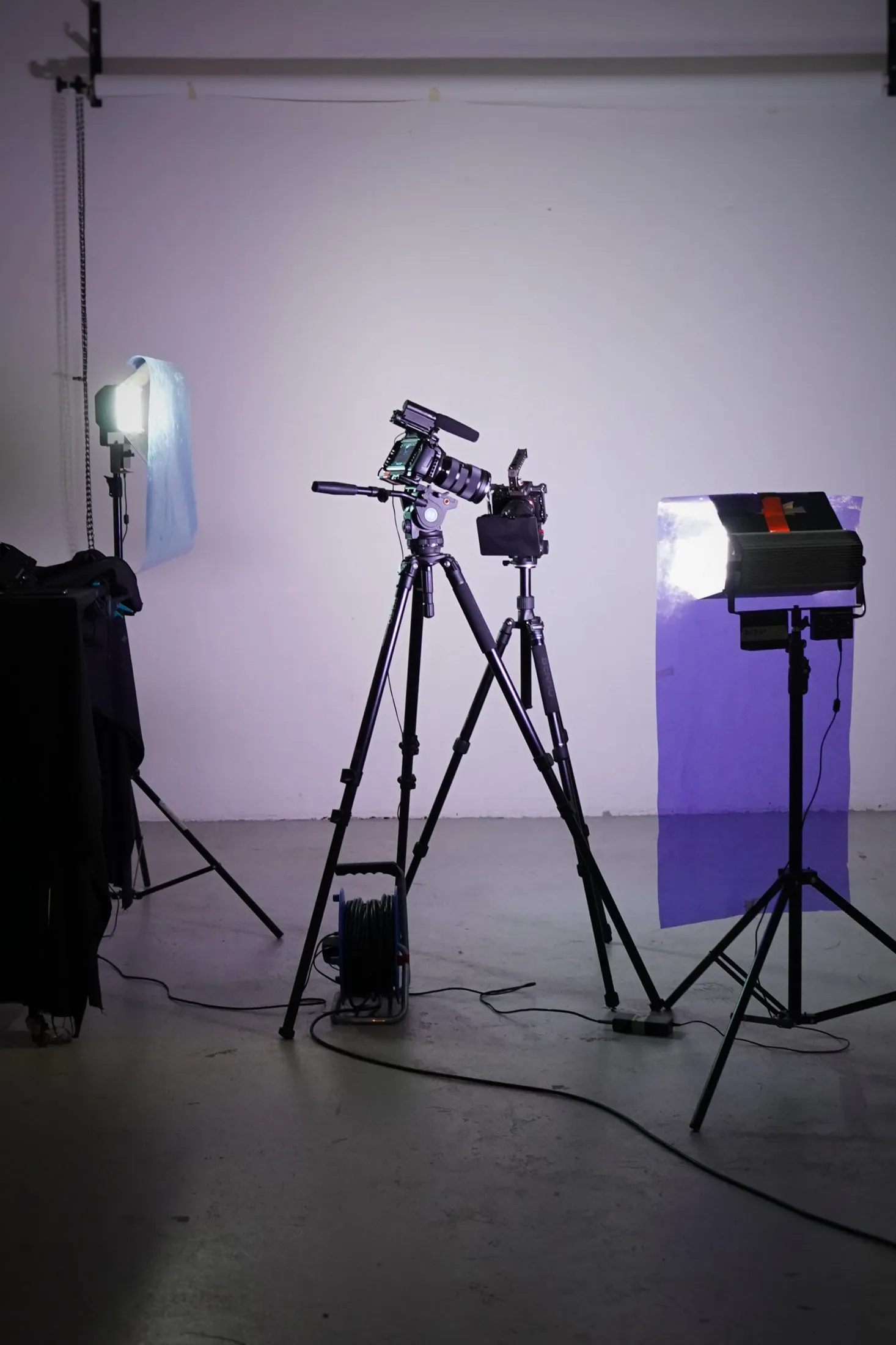 Studio film set: camera on a tripod and lights