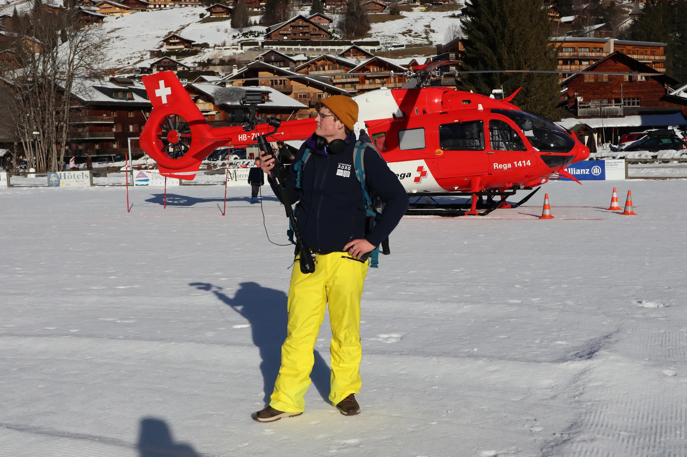Videographer with his camera on a shoot at a mountain resort