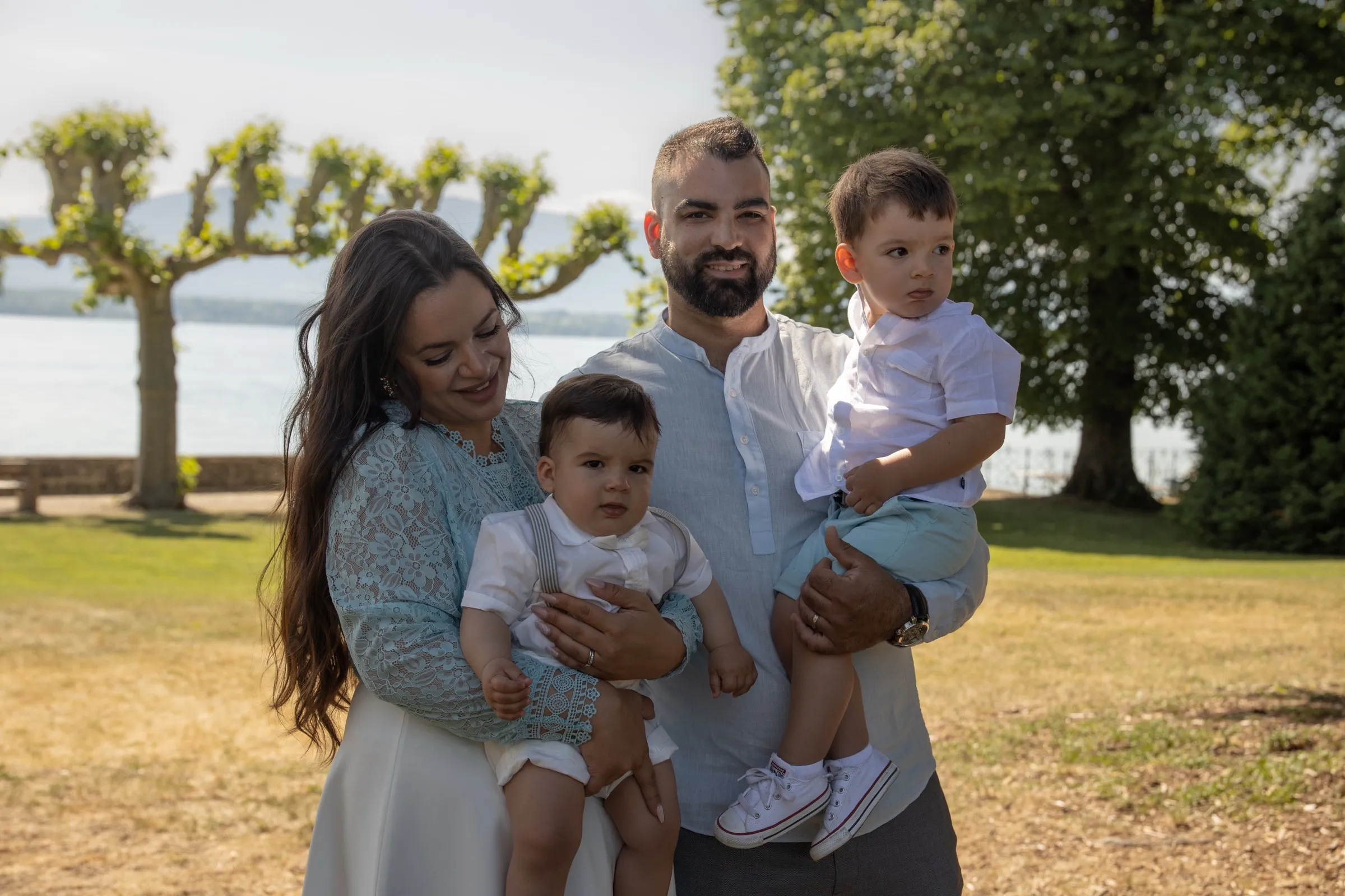 A family by the lake with a baby and a little boy