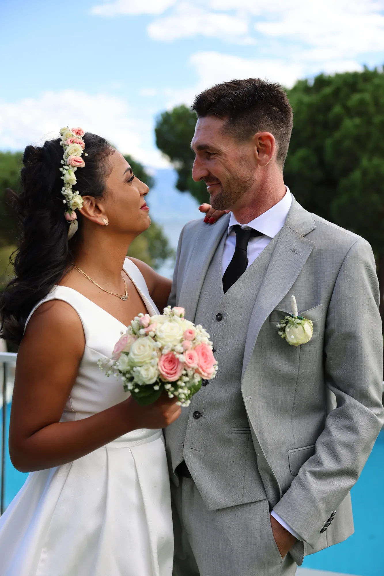 The couple smiling at each other