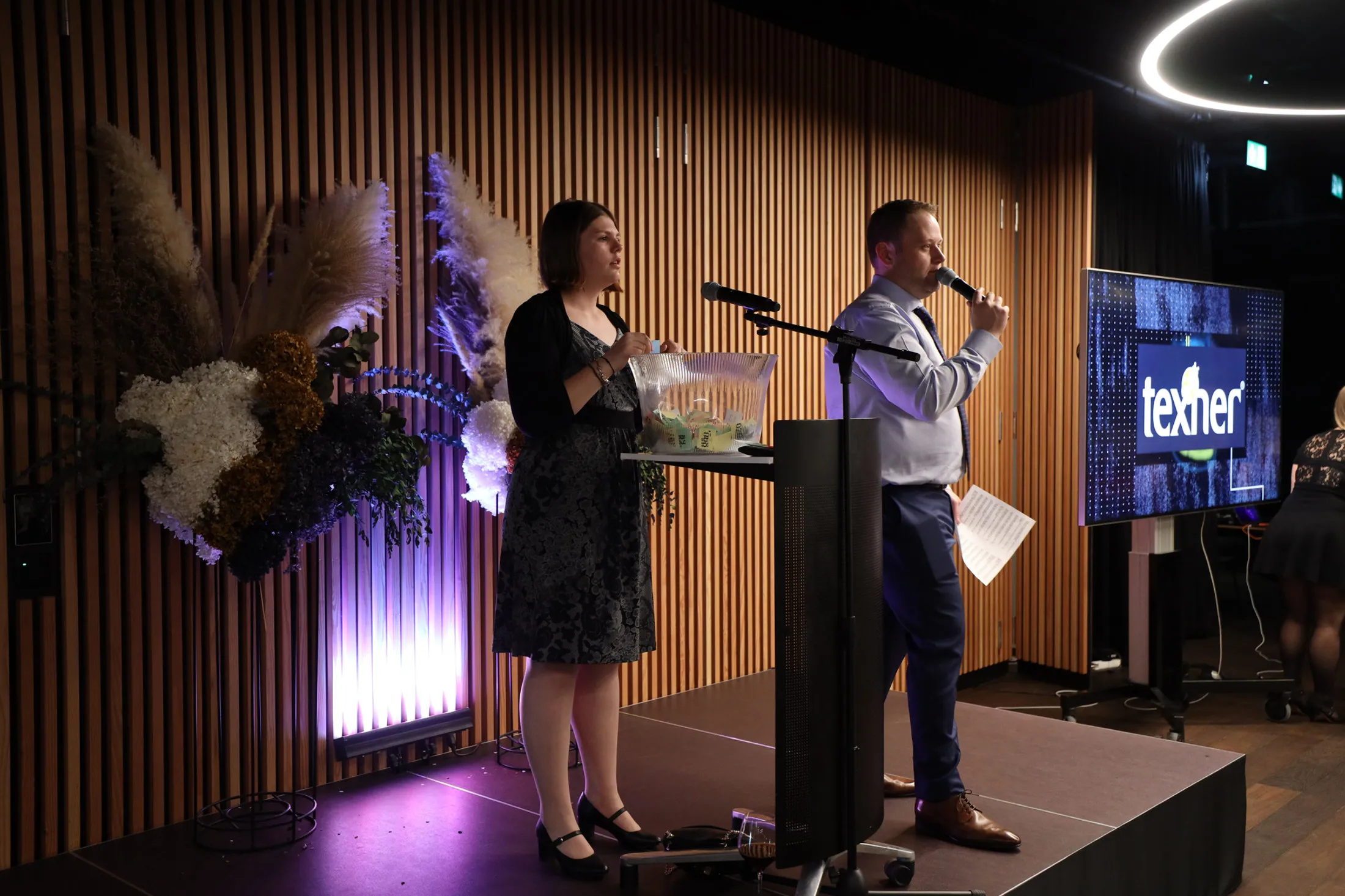 Speakers on stage at a corporate evening