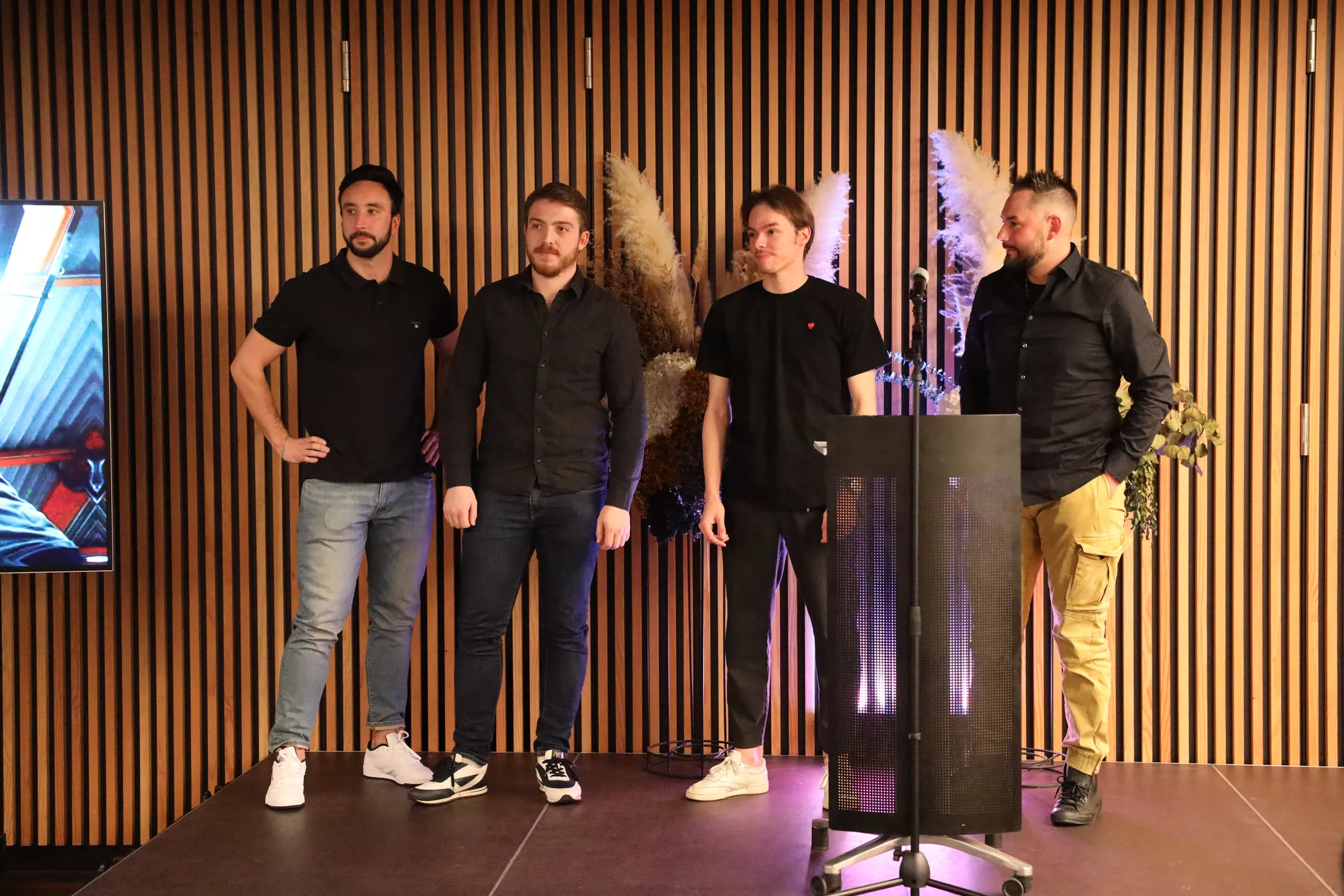 Team introduced on stage at a launch event