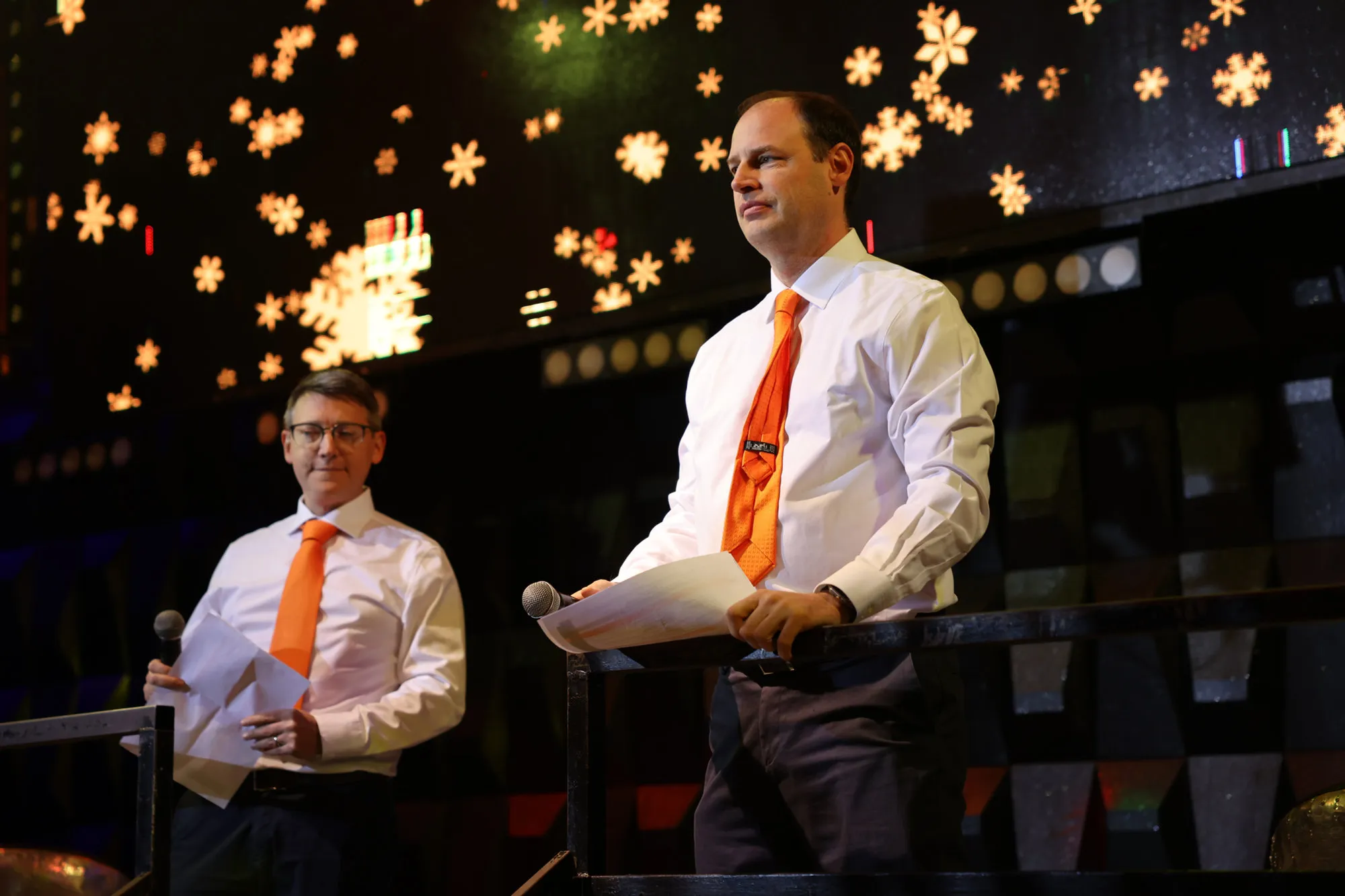 Speakers on stage at an evening event
