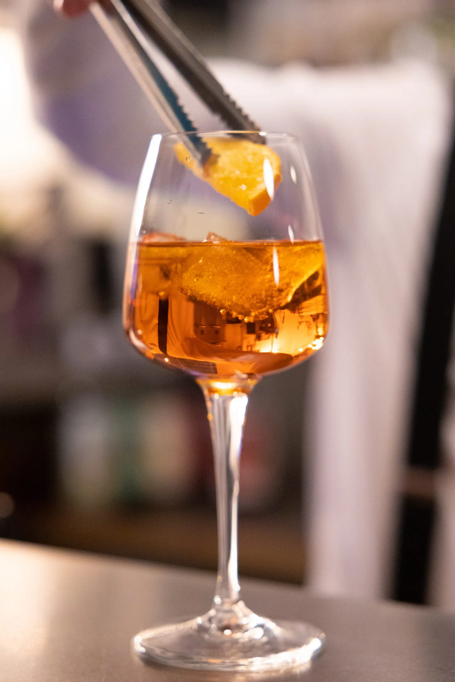 A spritz being poured at the bar