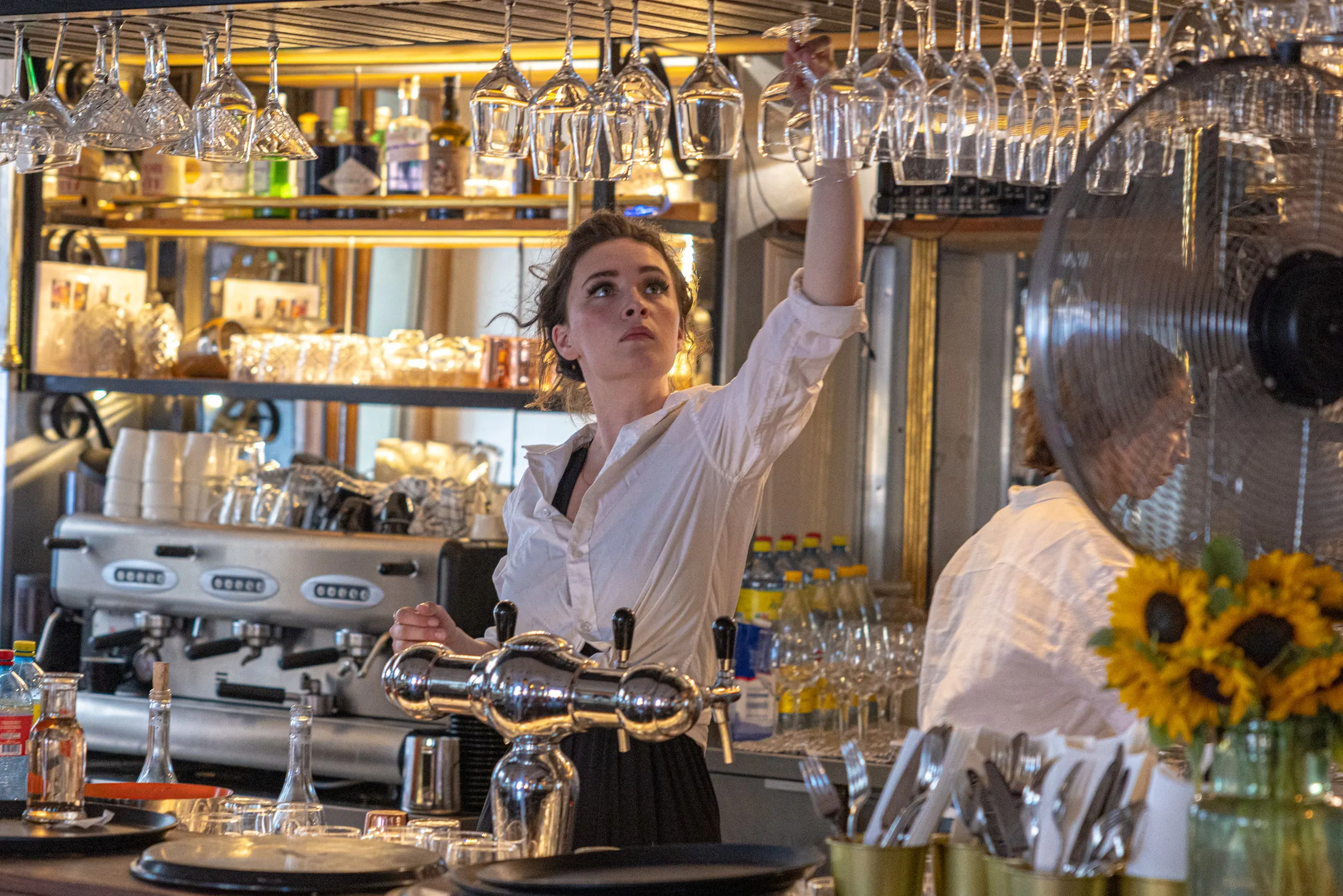 Bartender at work behind the counter