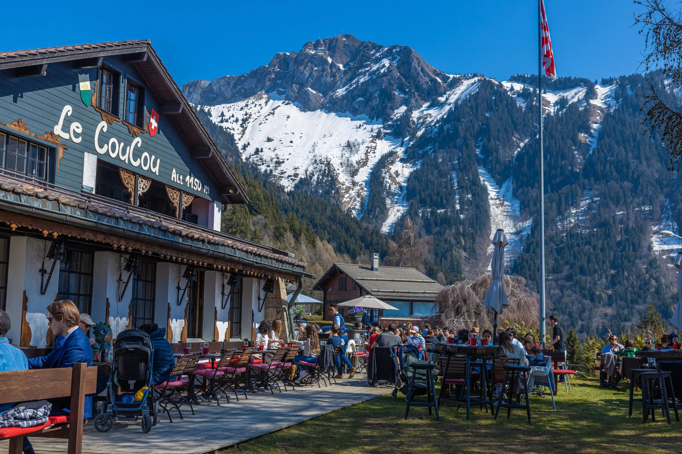 Mountain restaurant terrace with the Alps behind