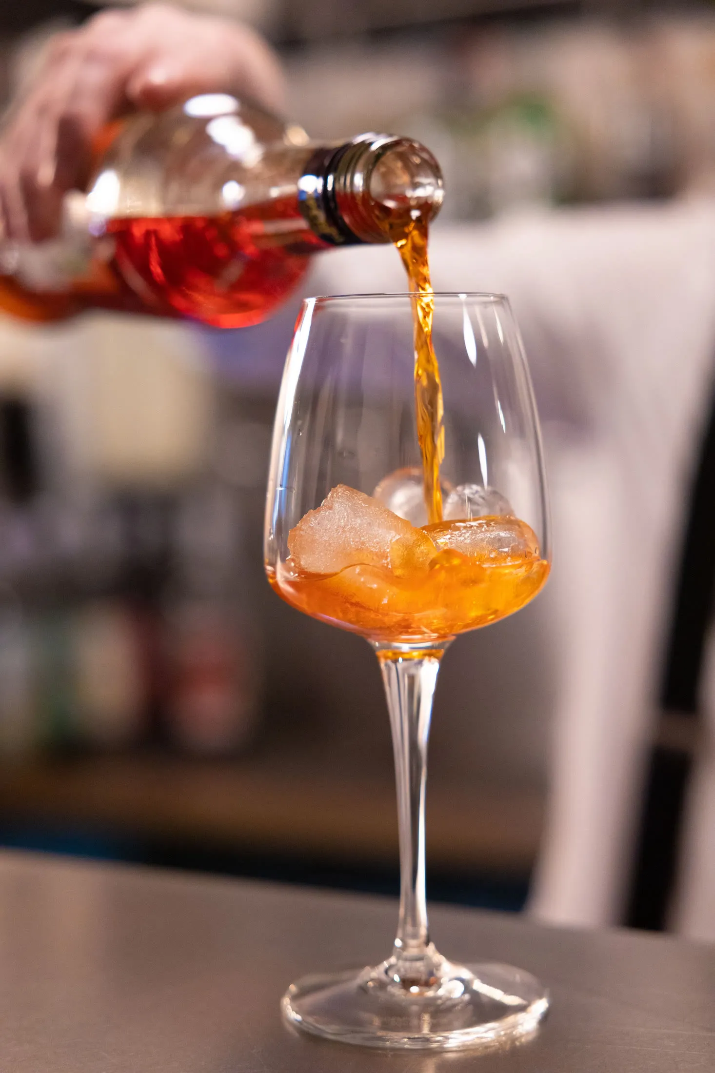 Spritz being poured into a glass at the bar