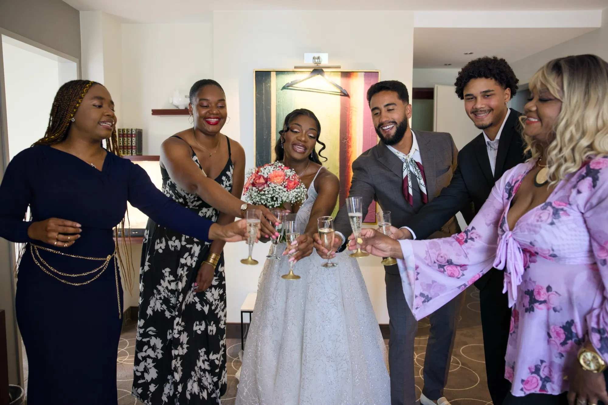The bride and her friends raise a glass before the ceremony