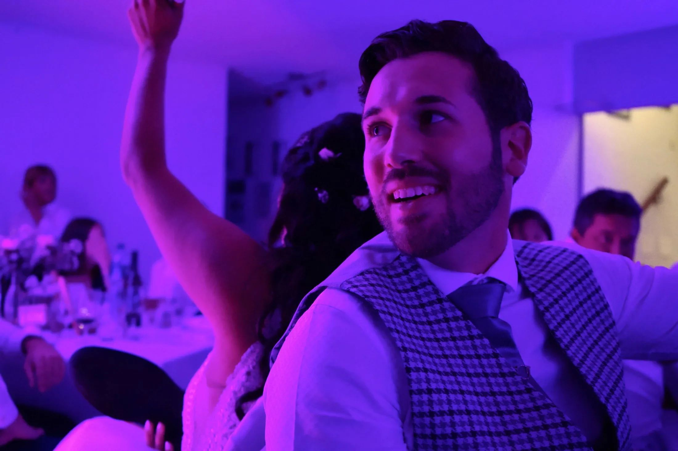 Guests dancing under the party lights