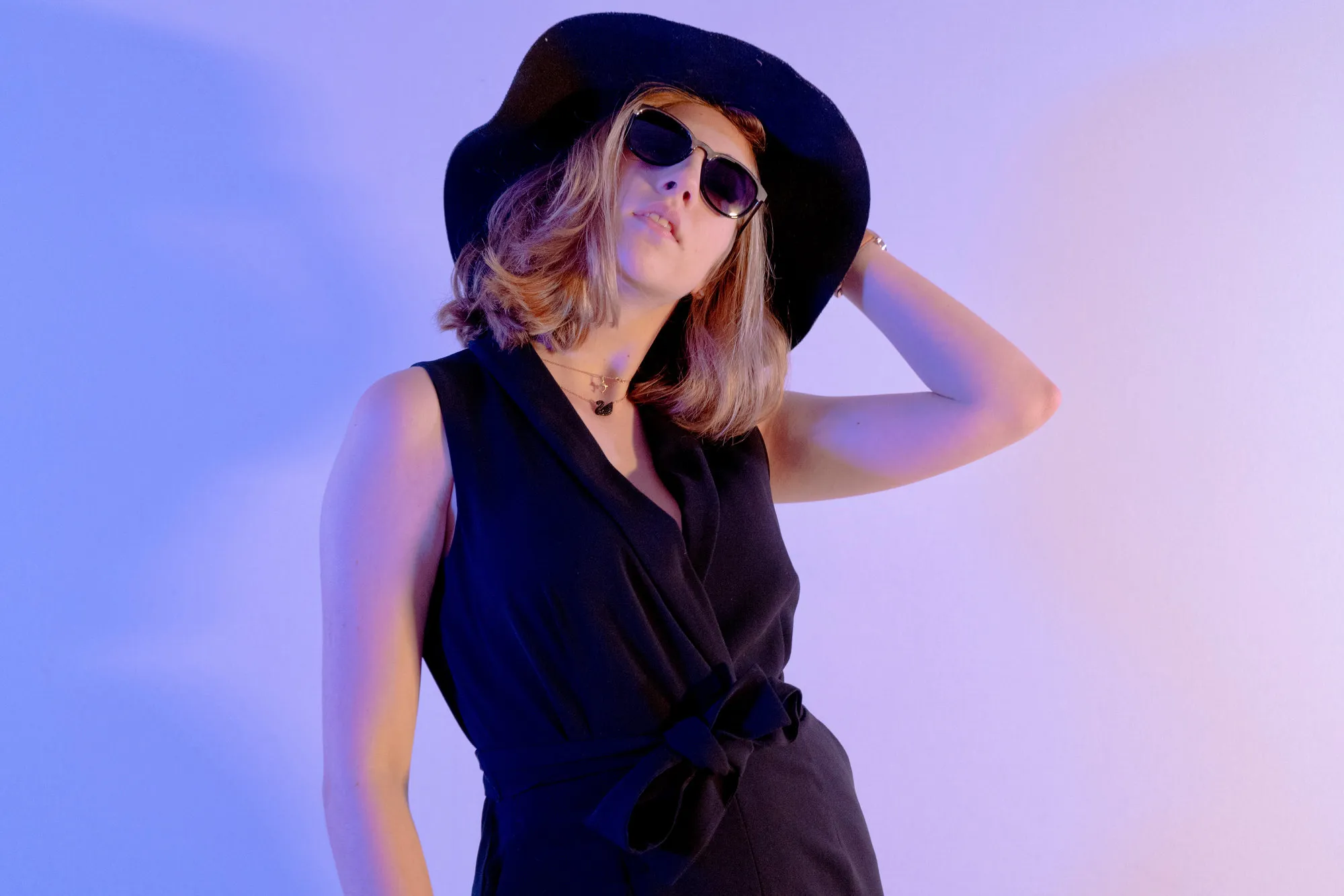 Portrait with a hat under blue light