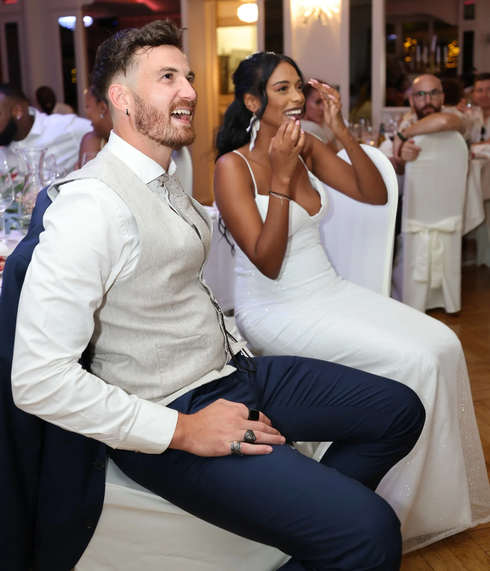 The couple bursting into laughter during dinner