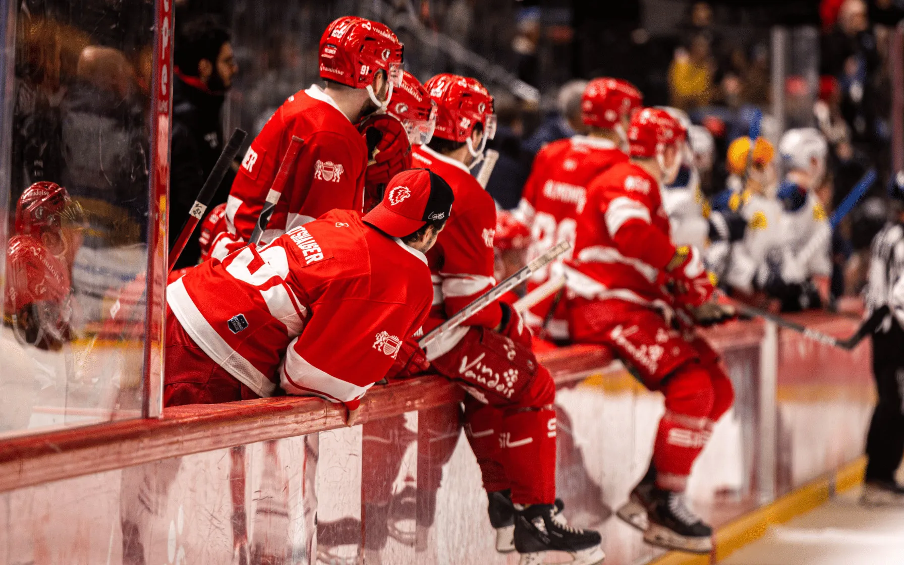 Hockey players on the bench during a game