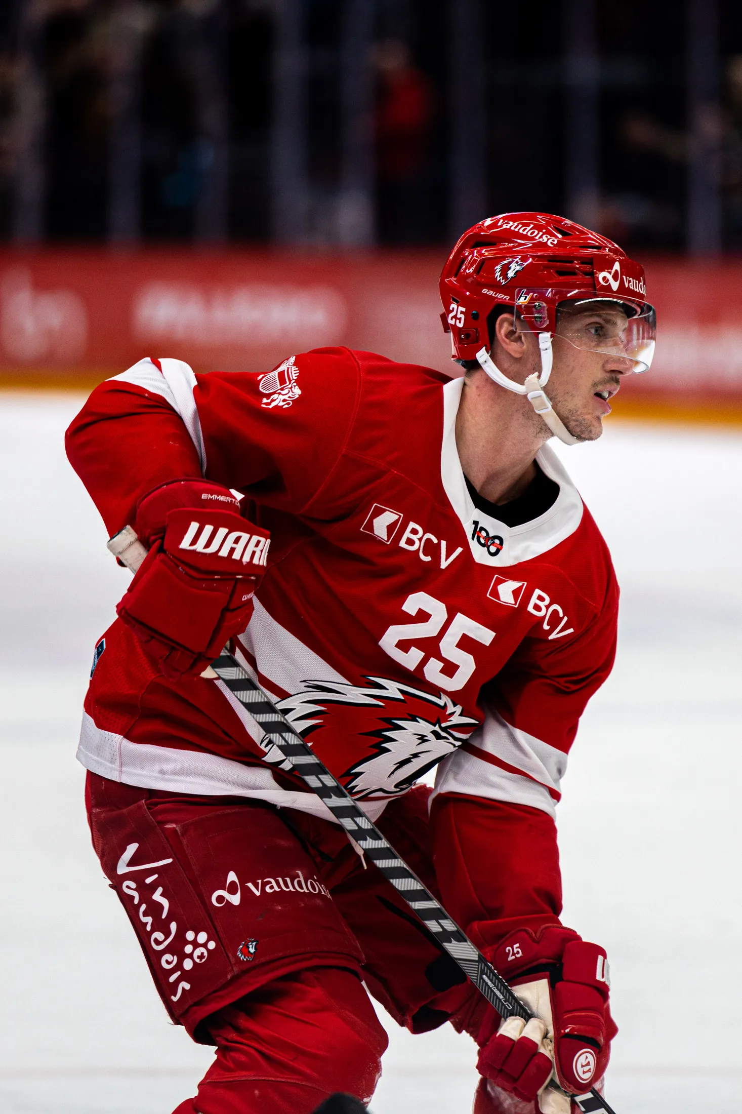 Hockey player in action in a red jersey